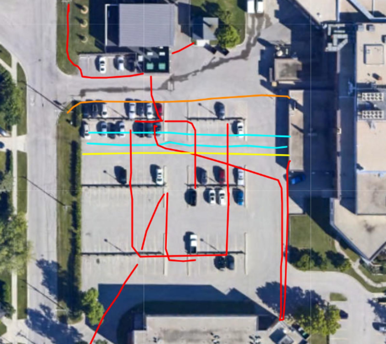 Mapped utilities crossing a paved parking lot